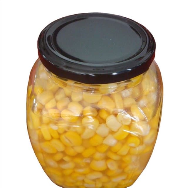 Ядро кукурузы консервов в олове